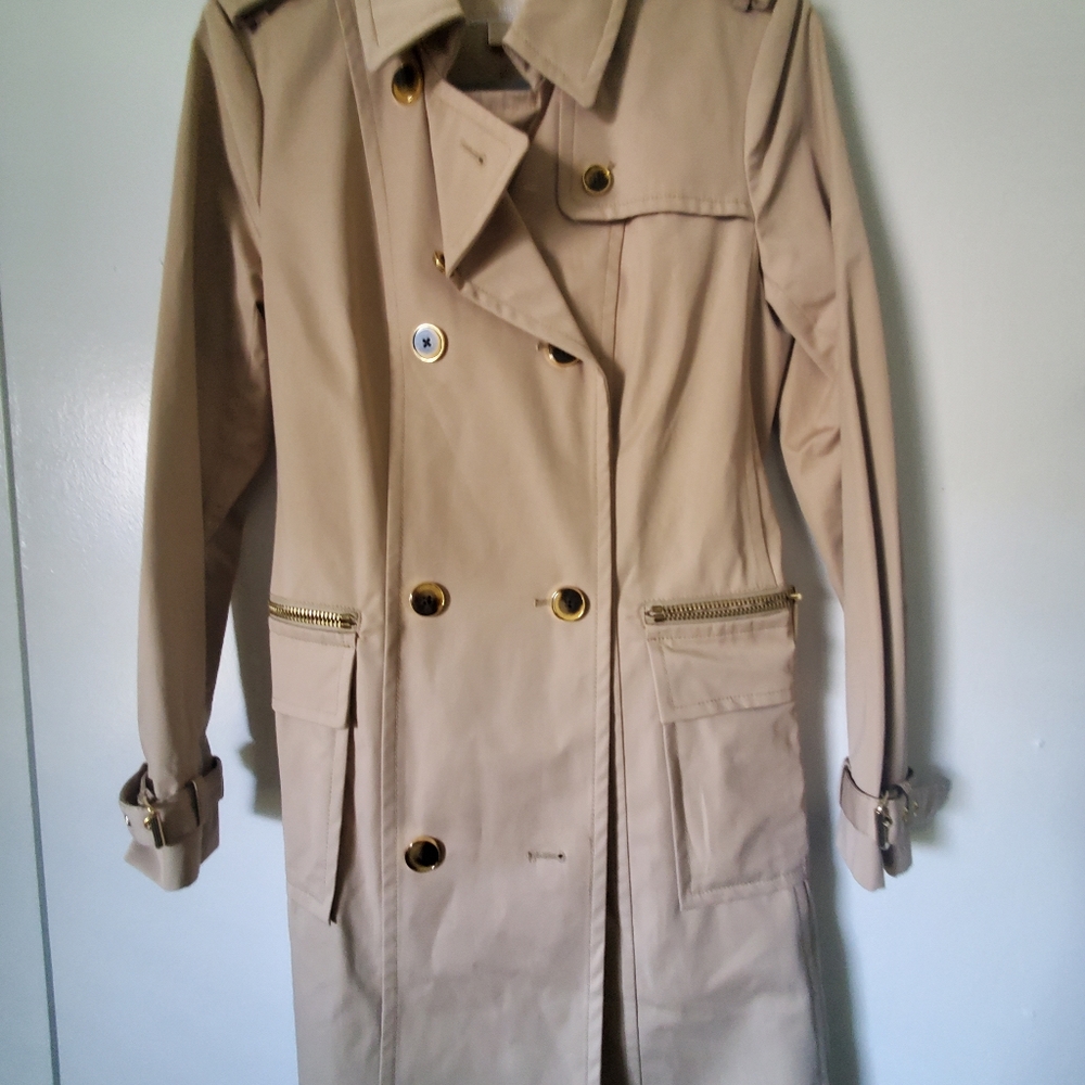 Micheal Kors light weight knee length rain jacket, tan in color, size medium